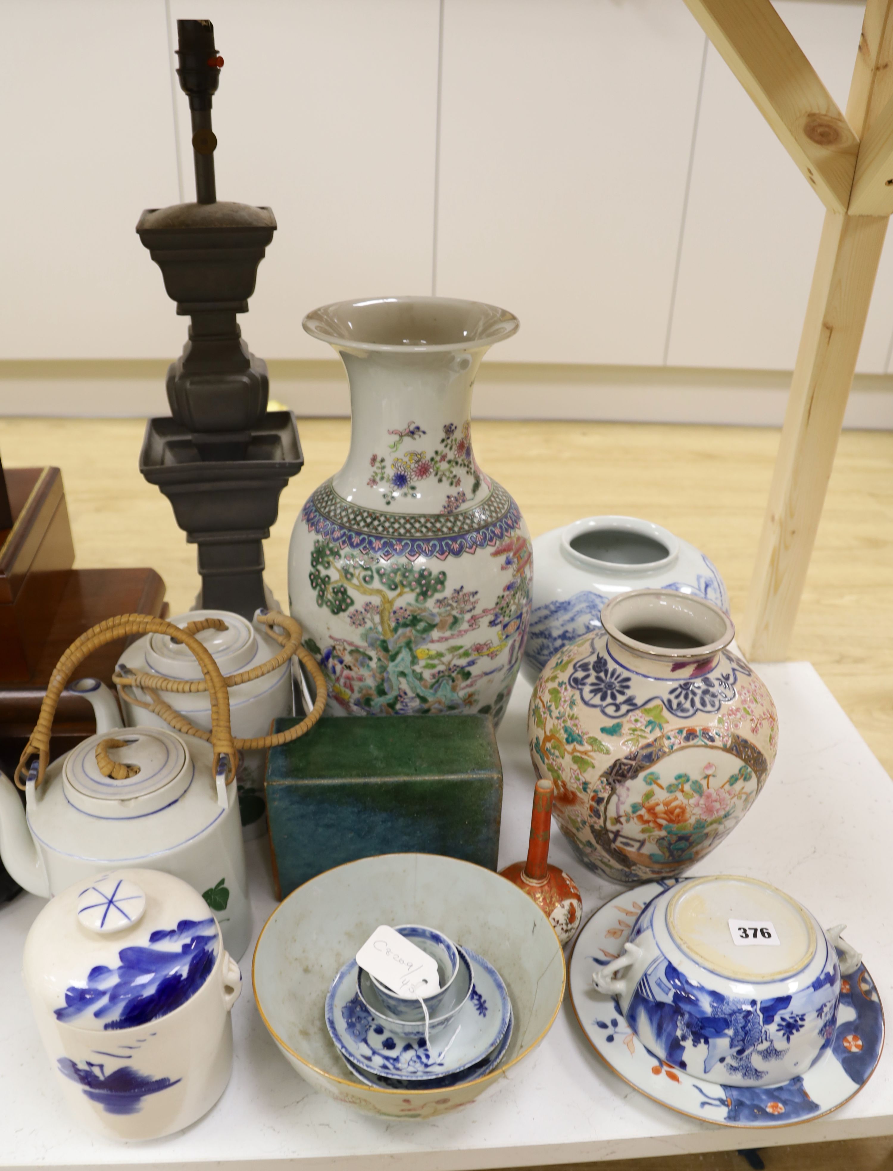 A Chinese famille rose vase, two teapots, mixed Chinese and Japanese ceramics and a lamp